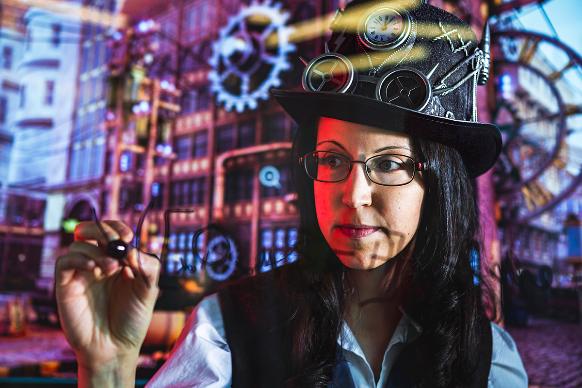 A photo of Nicole Yunger Halpern with a marker on glass board