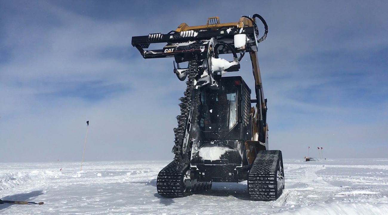 Close-up photo of a trencher, which digs grooves in the ice for power and data cables.