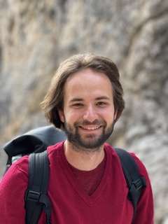 a photo of a man wearing a red shirt