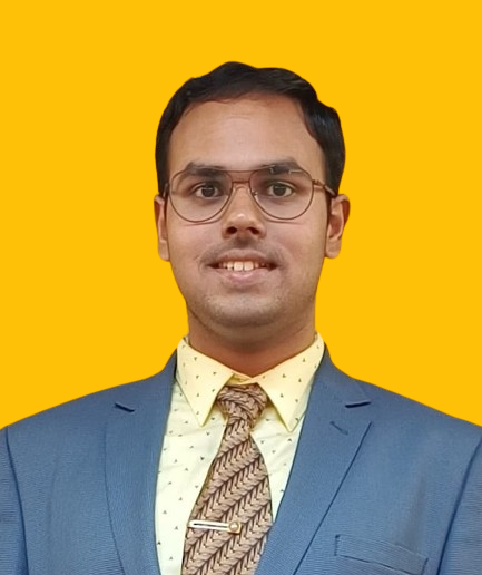 A smiling young man wearing a blue suit and glasses appears on a yellow background.